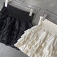 Black ruffle mini skirt
